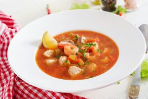 Brazilian food: Moqueca capixaba of fish and bell peppers in spicy coconut sauce